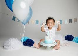 Happy one year old baby boy with birthday cake and happy parent on the background. Happy 1 Year Old Cake Smash Photography Orange Studios