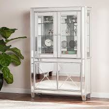 Add sophistication to any room with this lighted corner curio cabinet. Lavina Lighted Mirrored Curio Cabinet Kirklands