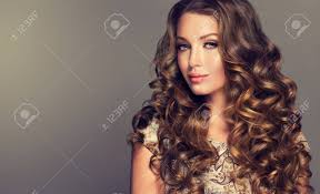 Another gorgeous haircut for men with curly hair. Young Woman Brunette With Voluminous Shiny And Wavy Hair Beautiful Stock Photo Picture And Royalty Free Image Image 76595093