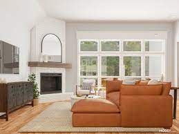 The furniture arrangement of this living room is spectacular! How To Design A Living Room With A Corner Fireplace Layout Modsy Blog