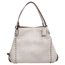 ~your closet should feel like a boutique: Shop Pre Owned Coach Cream Signature Embossed Leather Edie 31 Shoulder Bag
