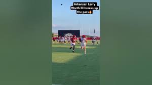 Arkansas’ Larry Worth III breaks up pass during fall camp