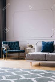 Maybe you would like to learn more about one of these? Petrol Blue Velvet Armchair In Stylish Living Room Interior In Trendy Apartment Stock Photo Picture And Royalty Free Image Image 124577865