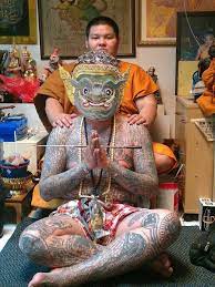 ajahn men anussa monk with his student man with tattoo and wearing a mask of phra phirab ศ ลปะไทย ไอเด ยรอยส ก ลายส ก