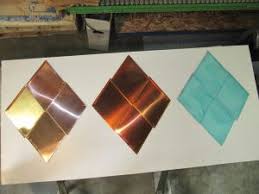 A solution is being applied to copper panels to accelerate patination (aging process for copper). Chemical Patinas For Copper Roofs And Copper Architectural Features Fine Metal Roof Tech