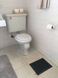 This 50 Temporary Flooring Floats Right Over Rental Bathroom Tile Rental Bathroom Luxury Vinyl Tile Bathroom Floor Coverings