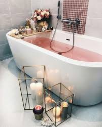 Woman preparing wellness bath with flowers, candles and fragrance oil in tub. 15 Indulging Valentine S Day Bathroom Decor Ideas Shelterness
