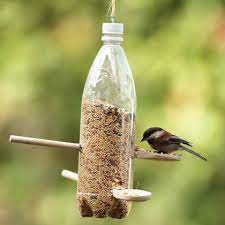 For The Birds 7 Yard Crafts To Attract Feathered Friends Soda Bottle Crafts Bird Feeders Bird Feeder Craft