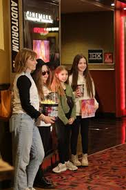 Swifties swiftly fill theaters to see Taylor Swift's “Eras” concert film