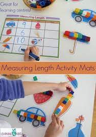 Your kids will enjoy comparing the weight of everyday objects in plastic containers using a bucket balance scale. Printable Measuring Length Learning Centre Mats Measurement Activities Measurement Kindergarten Preschool Math