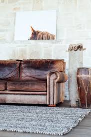 Distressed Leather Couch And Horse Art Great Living Room Space Leather Living Room Furniture Distressed Leather Couch Living Room Leather