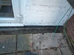 Dig a trench to channel water downhill and fill the trench with gravel so the water can filter down to the bottom of the trench. French Drain Against External Wall Dpc Diynot Forums