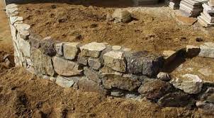 Some Simple Ideas To Build A Cheap But Nice Looking Rock Wall Stone Walls Garden Garden Rock Wall Garden Retaining Wall