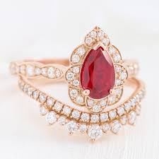 Most of our engagement rings contain beautiful combination of ruby and diamonds, and are set on white gold. Pear Vintage Floral Bridal Set W Ruby And Crown Diamond Band La More Design