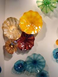 Each branch, adorned with blooming flower buds, climbs across the wall for a serene effect. 15 Glass Wall Art Ideas Glass Wall Art Glass Art Glass