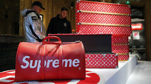 Pedestrians walk past an american skateboarding shop and clothing brand supreme store in shanghai on september 9, 2019. Vans Owner Vf Corp To Buy Streetwear Brand Supreme For 2 1 Billion