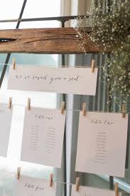 pretty white beach wedding reception seating chart rustic