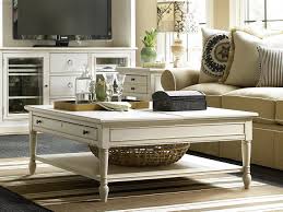 Crafted with a distressed whitewash finish, crossbuck detailing, and metal bracket appliques, this generously scaled coffee table is a rustic farmhouse living at its best. Universal Furniture Summer Hill 42 Square Cotton Lift Top Cocktail Table Uf987839