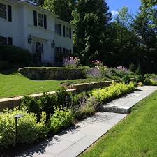Connect with the best landscapers in your area who are experts at installing landscaping in backyards, building gardens, adding water features and hardscaping, and more. Carey Ezell Landscape Design Blue Stone Walkway With Alchemilla Catmint And Peonies Landscape Design Stone Walkway Landscape Services