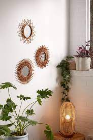 Urban outfitters stock a mixture of brands and boutique labels for both women and men as well as accessories, furniture, music, books there's also the urban outfitters home department that offers a special collection of bedding, furniture, tapestries, bathroom accessories, tech accessories, and more. Magical Thinking Woven Wall Mirror Urban Outfitters
