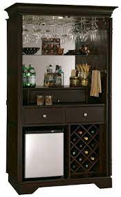 697024 howard miller game and entertainment niagara club chair black. Mini Bars For Home Howard Miller 695 104 Ty Pennington New York Loft Hide A Bar Wine Cabinet Best Price Home Bar Furniture Wine Bar Cabinet Wine Bar Furniture