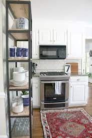 Adding Extra Shelving In Our Kitchen Emily A Clark Extra Kitchen Storage Kitchen Bookshelf Kitchen Remodel Small