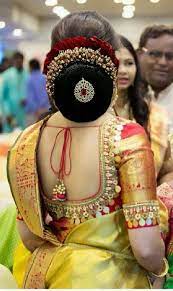 What A Beautiful Large Low Bun With Gajra Juda Pin Care However Should Be Taken Before A Bridal Hair Buns Indian Wedding Hairstyles Indian Bridal Hairstyles