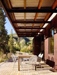 You might also like this photos or back to what everybody is saying about front porch overhang. How To Attach A Patio Roof To An Existing House And 10 Fantastic Patio Roof Ideas Homivi