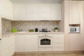 cream colored kitchen cabinets stock