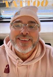 Gibson cat relaxing with iPod games