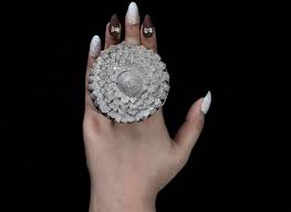 Since 1954, the world's wildest accomplishments have been carefully certified and documented by guinness world r. Ring With 12 638 Diamonds Breaks A Guinness World Record