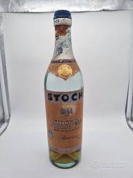 Stock 84 Bollino Oro liquore antico Trieste Brandy
