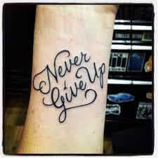 Tattoos are forever and that's exactly why most people think about the exact tattoo they want much before actually getting it inked. What Does Never Give Up Tattoo Mean Represent Symbolism