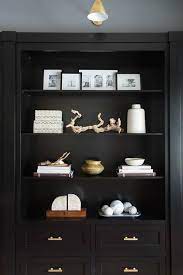 Shop wayfair for all the best desks, including home office desks. Gorgeous Home Office Features A Glossy Black Built In Shelves And Cabinets Adorned With Brass Pulls Lit By Boston Black Built Ins Built Ins Home Office Design