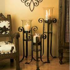 Lot of early american lighting, including 2 wrought iron adjustable trammel candleholders. Floor Candle Holders Floor Candle Holders Iron Decor Large Floor Candle Holders