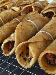 Latin american cuisine is fabulously fresh, flavorful and a bit spicy. Guatemalan Beef Taquitos Find Recipe In My Book Latin American Street Food Party Food Guatemalan Recipes Food Recipes