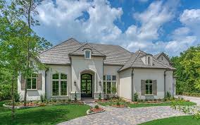 The archways and multi stained floor echo the southwest feel of this home built by keystone custom. 513 Grand Palisade Place Montgomery Tx 77316 Photo Estate Homes French Exterior Architecture Design