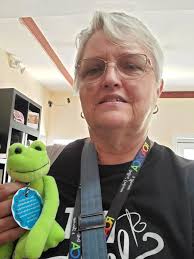 Does anyone recognize the crochet frog seller at Frog Follies?