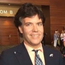 Who is running for Des Moines City Council's at-large seat?