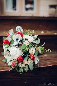 Our 990.00 package includes bridal bouquet & throw away bouquet~ groom boutonniere, 2 mom corsages, 2 dad boutonnieres, 2 altar arrangements, 1 b&g table arrangement. Wedding Flower Designs Take A Look At Our Beautifully Creative Wedding Designs Red Tulips Bouquet Wedding Flowers Bridal Bouquet Peonies