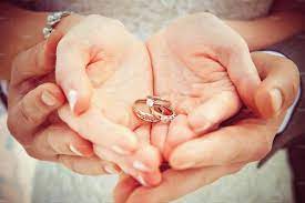 Hands And Rings On Wedding Bouquet Bright Photos Wedding Candles Wedding Rings