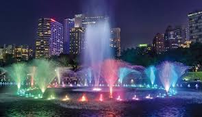 A colorful water fountain show in klcc twin tower park. Klcc Oase