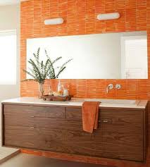 20 Beautiful Bathrooms That Aren T Afraid Of Color Modern Bathroom Wall Decor Orange Bathrooms Designs Orange Bathrooms