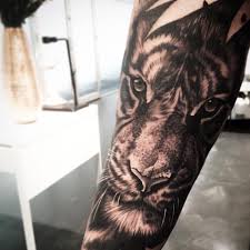 Realistic Grey Ink Tiger Tattoo On Forearm By Levi Barnett Tiger Tattoo Tiger Tattoo Images Forearm Tattoos