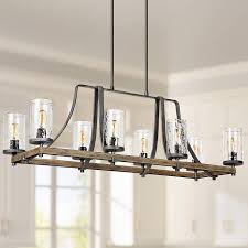 At the center is a rectangular kitchen island in oak finish and topped with plain white solid surface, with integrated storage, sink and dining area. Angelo 46 W Weathered Oak Kitchen Island Light Chandelier 18w26 Lamps Plus