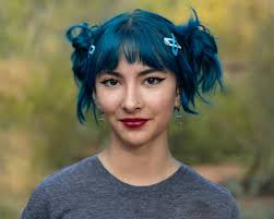 My daughter Ruby tried out a new hairdo today. I love it. Some of you might  think she dyed her hair blue, but that's actually its natural color. In  fact all of