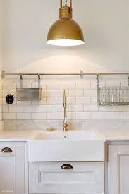 Navy painted kitchen island + brass fixtures + brass faucet + wine fridge in the kitchen island here she is in all her glory. 25 Ways To Enhance Your Kitchen With Brass Fixtures