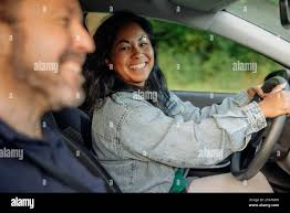 Electric car man woman sitting hi-res stock photography and images