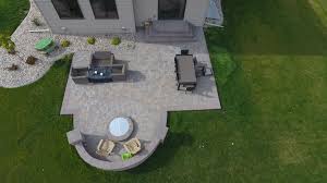 Sitting around a crackling fire pit on a chilly fall or early winter evening is one of the most enjoyable things in life! Backyard Fire Pit With Seat Wall And Paver Patio Oasis Landscapes