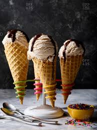 Maybe you would like to learn more about one of these? Ice Cream Cones With Sprinkles And Chocolate Fudge Being Prepared In A Cone Stand Stock Photo Offset